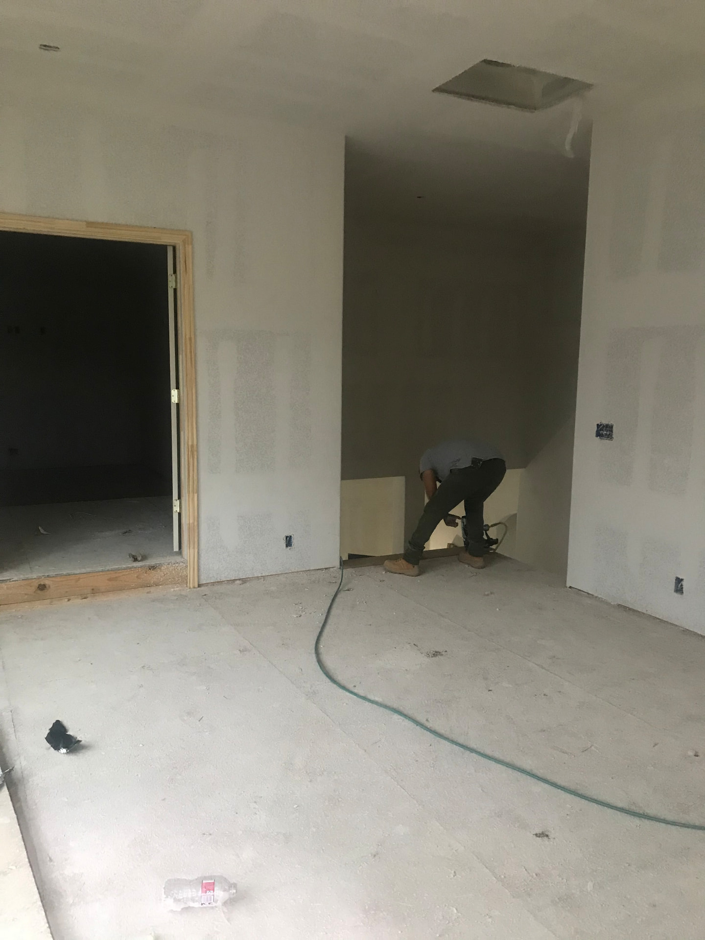 Drywall hung, taped, and floated ahead of trim and paint.