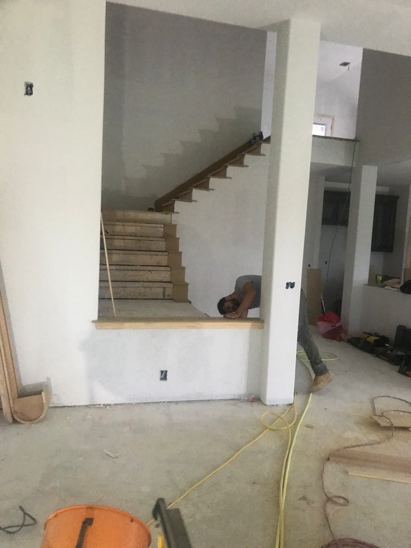 Stair treads, trim carpentry, and finish-out ahead of final walkthrough.